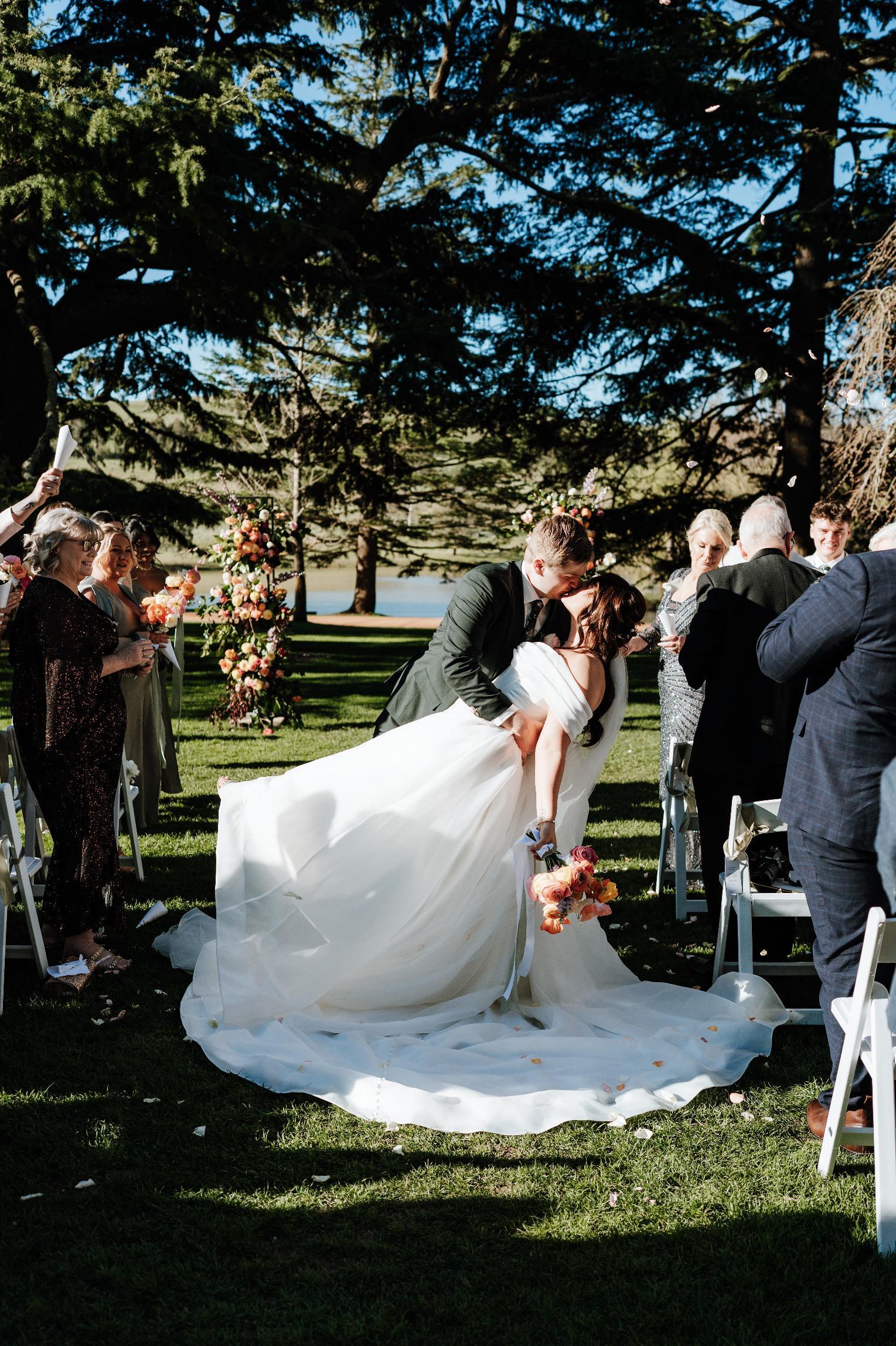 Wedding ceremony at Bundanoon, a couple exchanging vows outdoors.